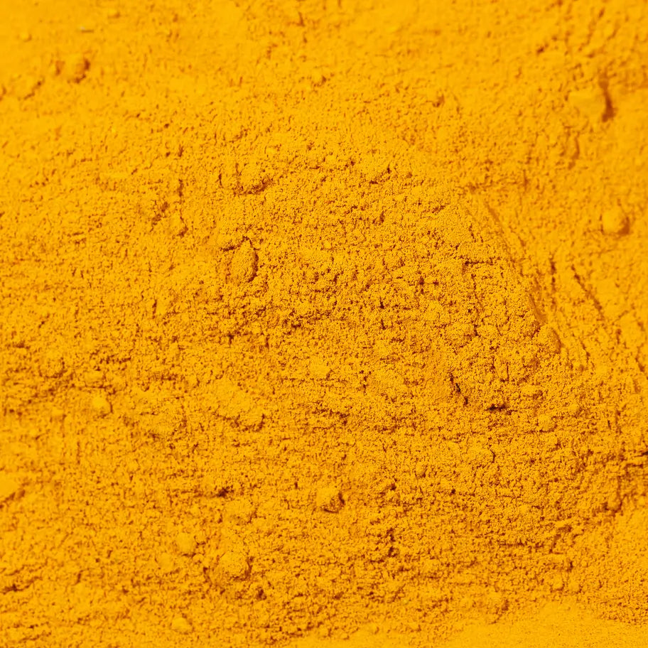 Close-up of golden vitamin powder