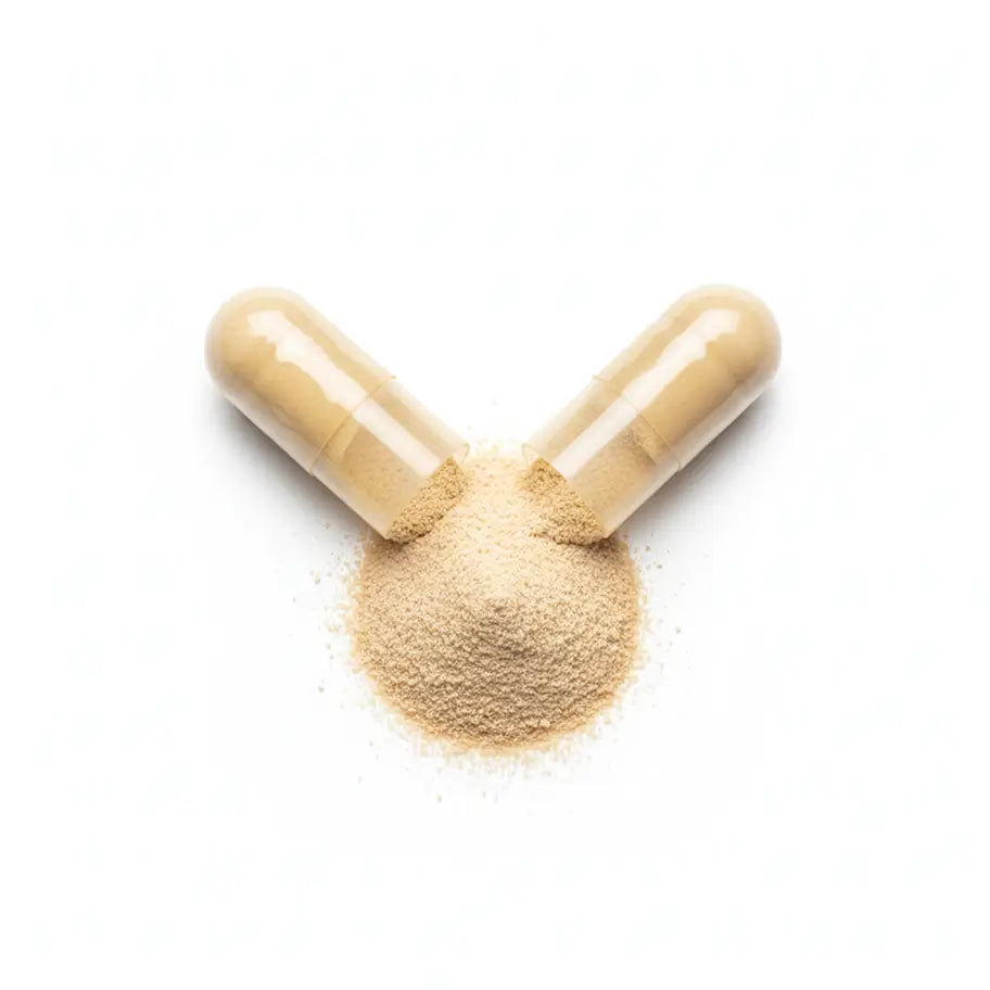 Two capsules spilling a mound of pale powder